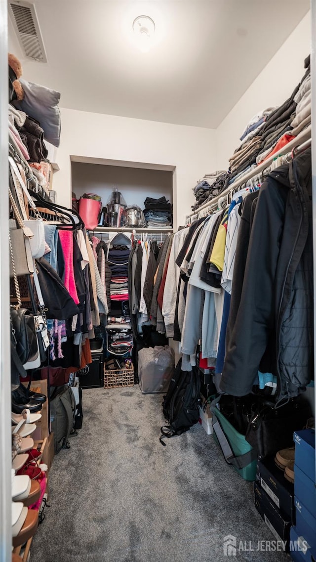 spacious closet featuring carpet floors and visible vents