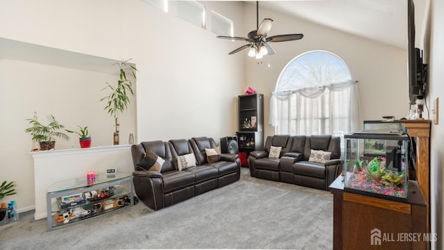 living room featuring carpet floors, ceiling fan, and high vaulted ceiling