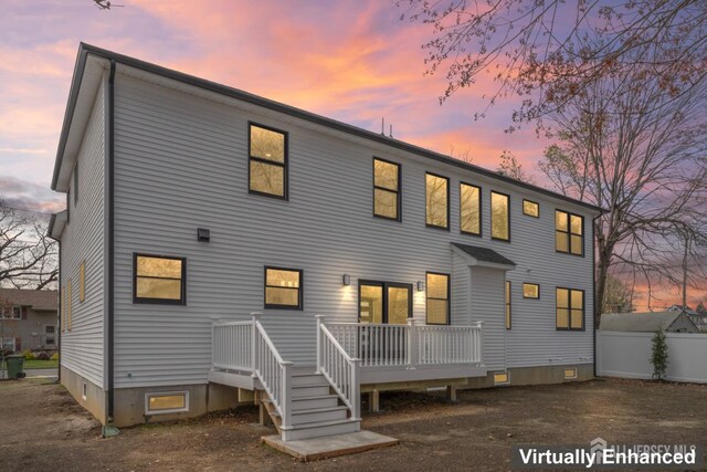 23 Redwood Ave, Edison, NJ 08817 - back of property at dusk featuring a deck and fence
