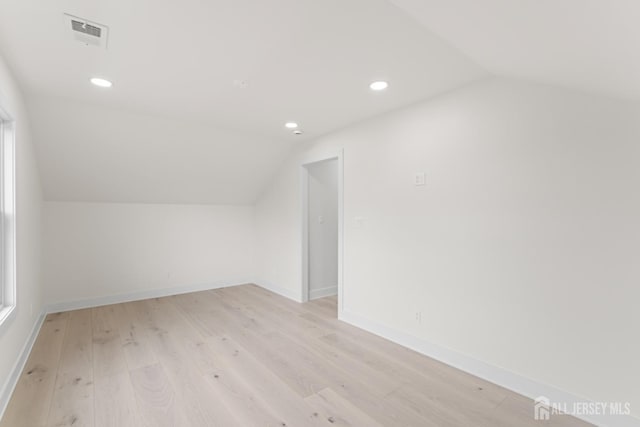 23 Redwood Ave, Edison, NJ 08817 - additional living space featuring lofted ceiling, light wood-style floors, recessed lighting, and baseboards