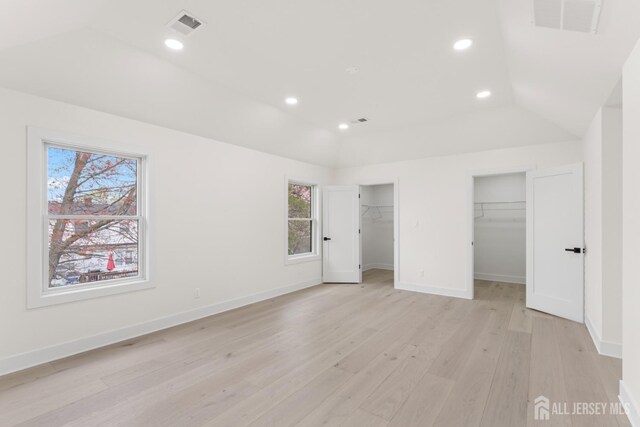 23 Redwood Ave, Edison, NJ 08817 - unfurnished bedroom featuring multiple windows, light wood-style flooring, vaulted ceiling, baseboards, and recessed lighting