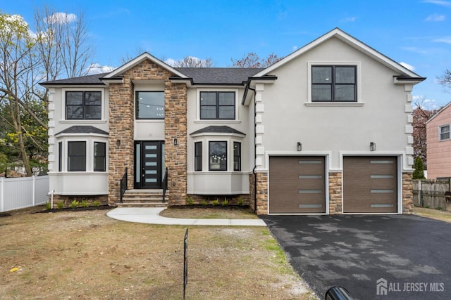 view of front facade featuring fence, an attached garage, driveway, and stucco siding