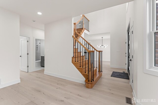 23 Redwood Ave, Edison, NJ 08817 - foyer entrance featuring stairs, light wood-style floors, baseboards, recessed lighting, and a chandelier
