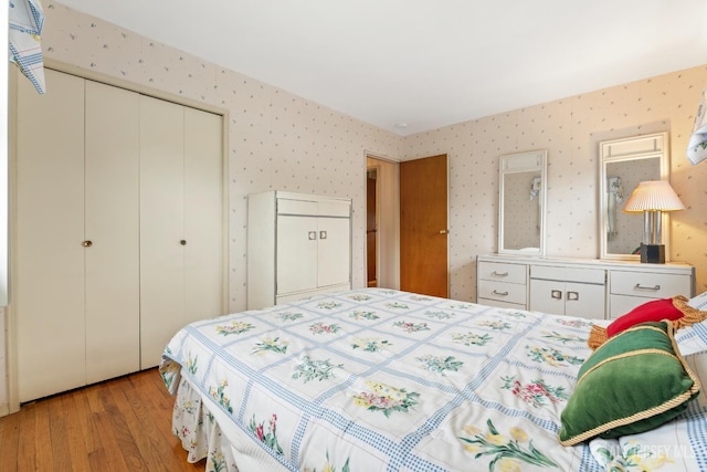 10 Denman Dr, Fords, NJ 08863 - bedroom with light wood-type flooring, a closet, and wallpapered walls