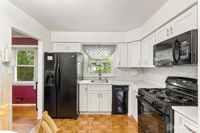 10 Denman Dr, Fords, NJ 08863 - kitchen featuring black appliances, light countertops, white cabinetry, and decorative backsplash