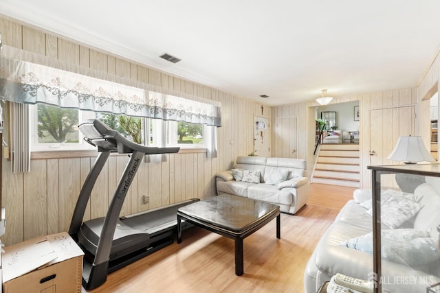 10 Denman Dr, Fords, NJ 08863 - living area with light wood-type flooring and wood walls