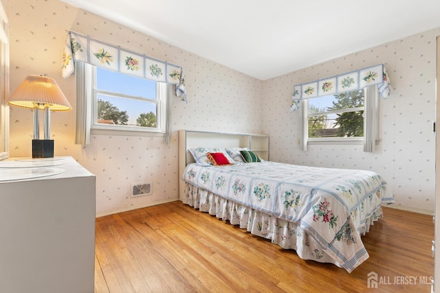 10 Denman Dr, Fords, NJ 08863 - bedroom with wood-type flooring and wallpapered walls
