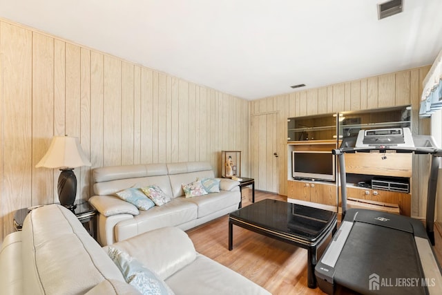 10 Denman Dr, Fords, NJ 08863 - living room featuring wooden walls and wood finished floors