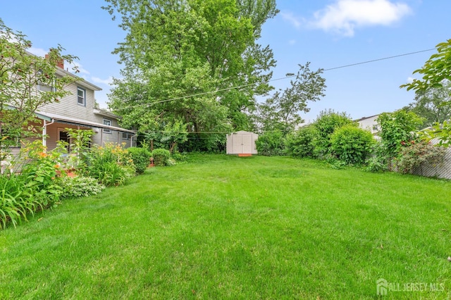 10 Denman Dr, Fords, NJ 08863 - view of grassy yard featuring a shed
