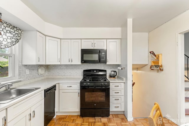 10 Denman Dr, Fords, NJ 08863 - kitchen with black appliances, light countertops, backsplash, and white cabinetry