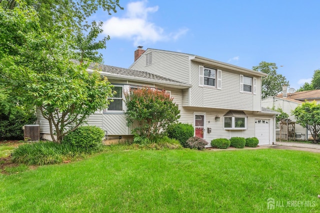 10 Denman Dr, Fords, NJ 08863 - view of front of property featuring a chimney, driveway, and a front yard