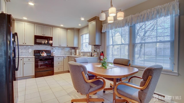 741-B Nautilus Ct Unit B, Monroe, NJ 08831 - kitchen featuring black appliances, a sink, backsplash, decorative light fixtures, and light tile patterned flooring
