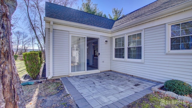 741-B Nautilus Ct Unit B, Monroe, NJ 08831 - view of exterior entry with a patio and a shingled roof