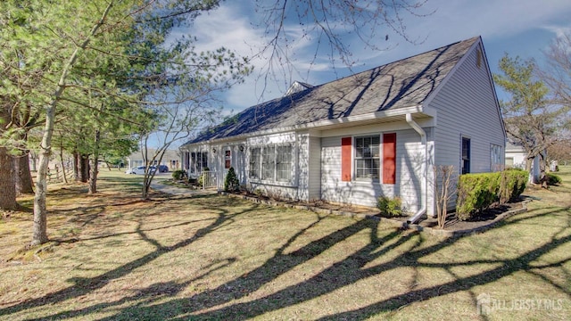 741-B Nautilus Ct Unit B, Monroe, NJ 08831 - view of property exterior featuring a shingled roof and a yard