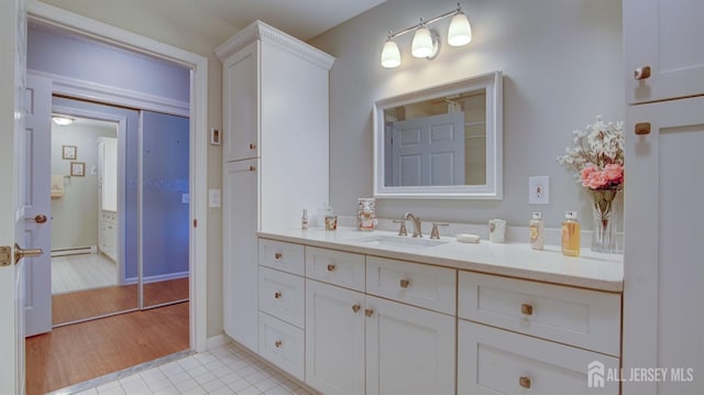 741-B Nautilus Ct Unit B, Monroe, NJ 08831 - bathroom with vanity, a baseboard radiator, and tile patterned flooring