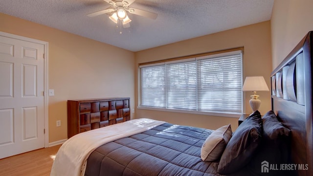 741-B Nautilus Ct Unit B, Monroe, NJ 08831 - bedroom featuring wood finished floors, a textured ceiling, a ceiling fan, and baseboards