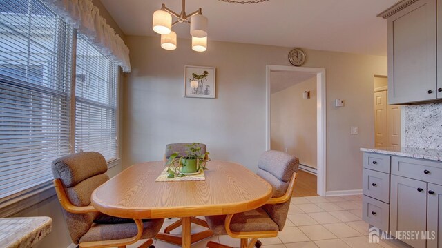 741-B Nautilus Ct Unit B, Monroe, NJ 08831 - dining area with a chandelier, light tile patterned flooring, a baseboard radiator, and baseboards