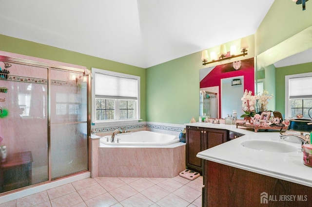 bathroom featuring tile patterned flooring, vanity, plenty of natural light, and separate shower and tub