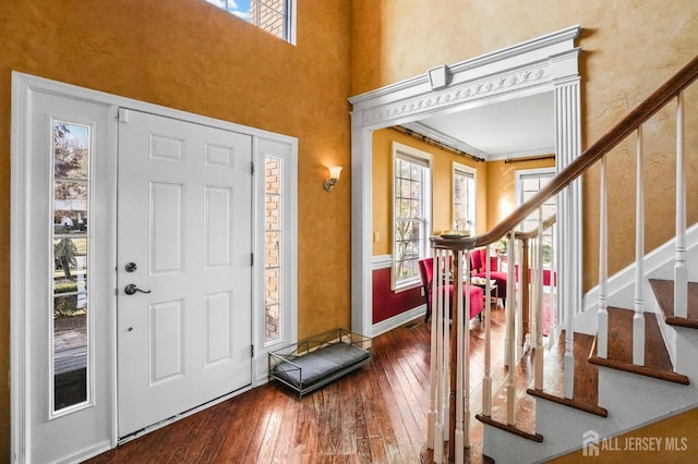 entryway with hardwood / wood-style flooring and a healthy amount of sunlight