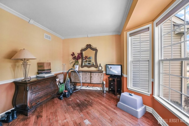 office space featuring wood-type flooring and ornamental molding