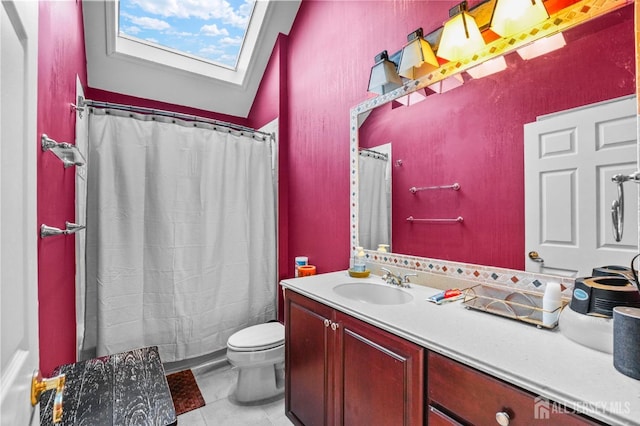 bathroom with vanity, a skylight, toilet, and a shower with shower curtain