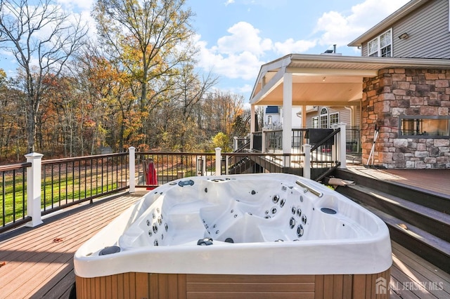 deck featuring a hot tub