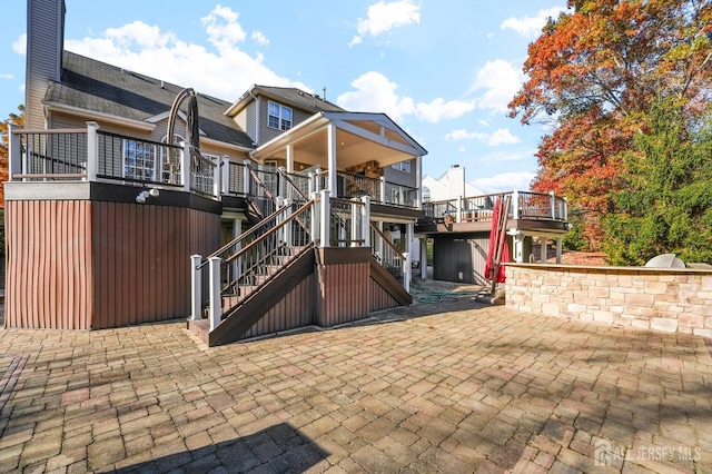 exterior space featuring a patio and a deck