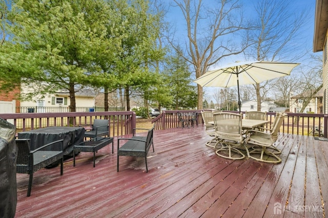 wooden terrace featuring outdoor dining space