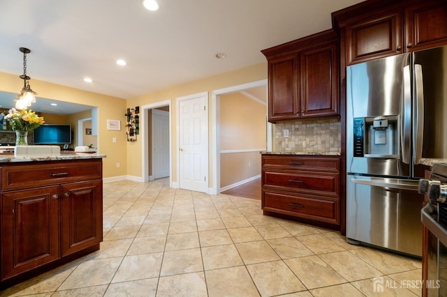 kitchen with light tile patterned floors, decorative light fixtures, stainless steel refrigerator with ice dispenser, backsplash, and recessed lighting