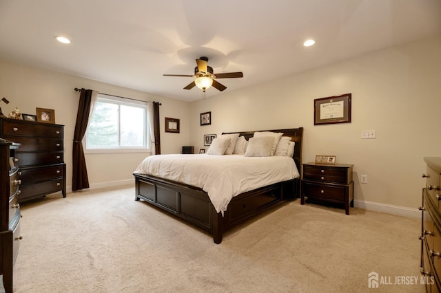 bedroom featuring baseboards, recessed lighting, and light colored carpet