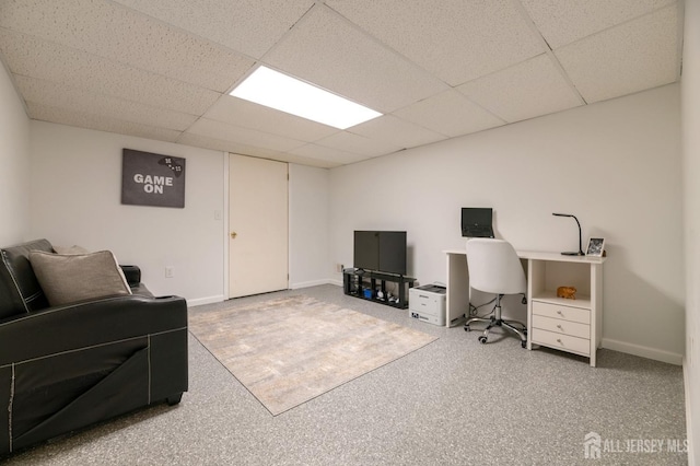 office featuring baseboards and a drop ceiling