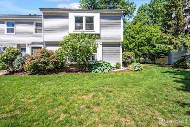 58 La Rue Ln, East Brunswick, NJ 08816 - back of property with a lawn