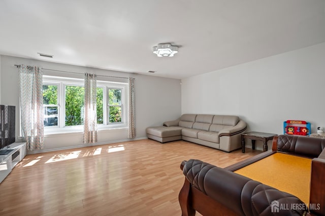 58 La Rue Ln, East Brunswick, NJ 08816 - living area featuring wood finished floors and baseboards