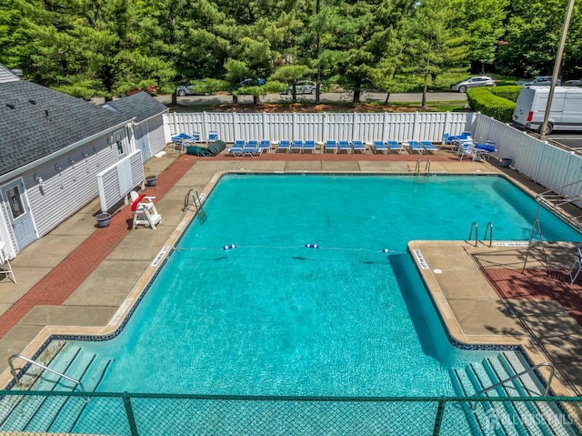 58 La Rue Ln, East Brunswick, NJ 08816 - community pool with a fenced backyard and a patio