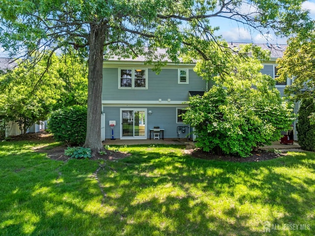 58 La Rue Ln, East Brunswick, NJ 08816 - back of property with a lawn and a patio area