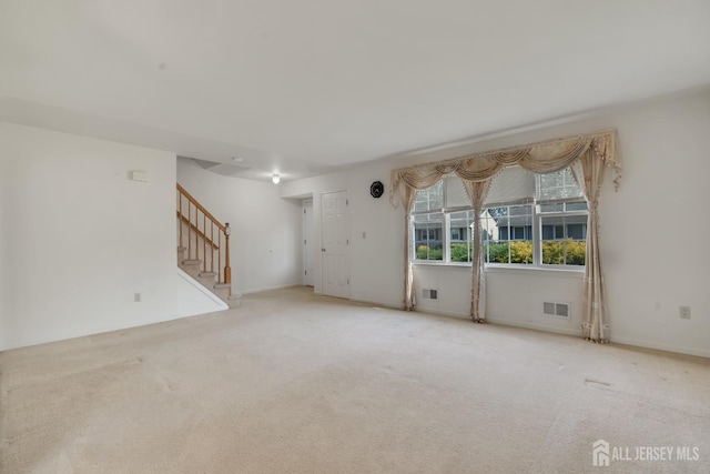 136 Carroll Ave, Woodbridge Proper, NJ 07095 - empty room featuring stairway and carpet