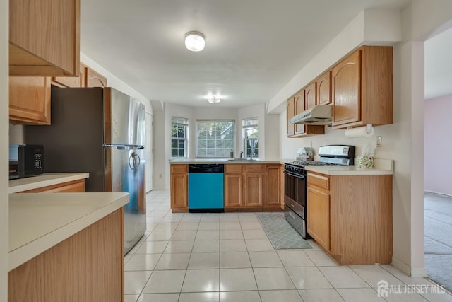 136 Carroll Ave, Woodbridge Proper, NJ 07095 - kitchen featuring dishwashing machine, gas range, under cabinet range hood, black microwave, and light countertops