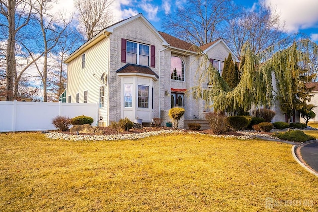 view of property featuring a yard