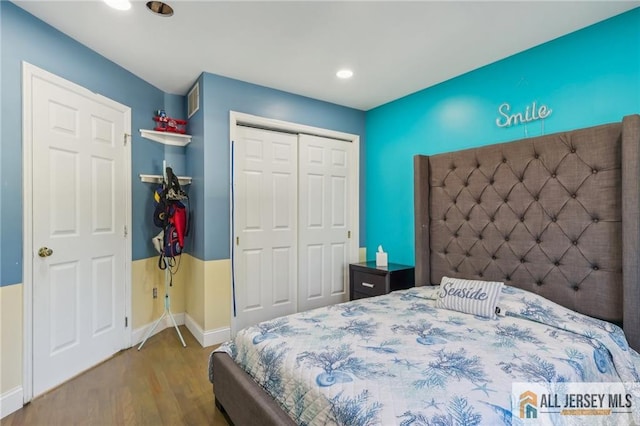 321 Snowgoose Ln, Harrison, NJ 08062 - bedroom featuring wood finished floors, a closet, baseboards, and recessed lighting