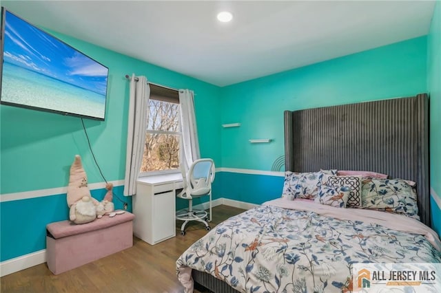 bedroom featuring hardwood / wood-style flooring