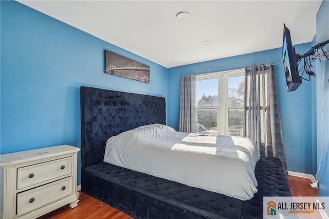 bedroom featuring dark wood-type flooring