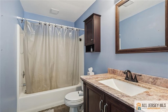 full bathroom featuring tile patterned flooring, shower / bath combo, vanity, and toilet