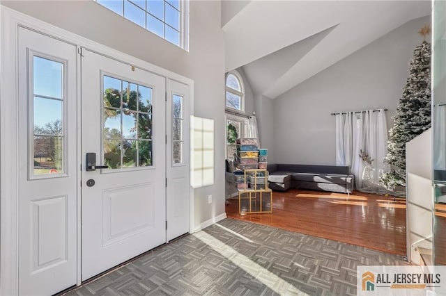 321 Snowgoose Ln, Harrison, NJ 08062 - entrance foyer featuring high vaulted ceiling and parquet floors