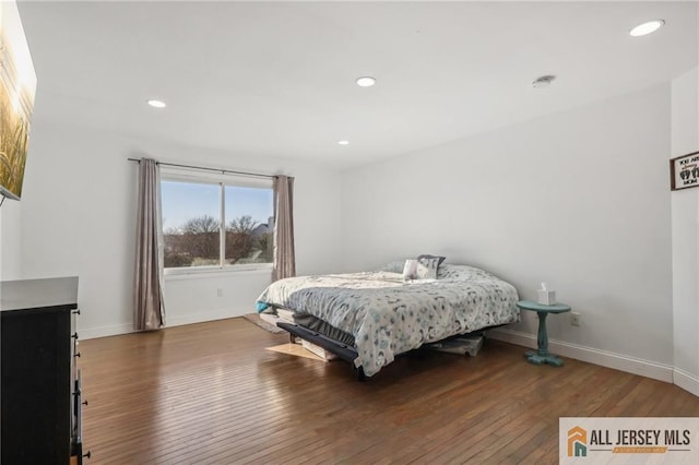 bedroom featuring dark wood-type flooring