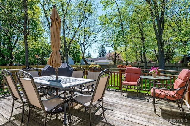 4 Hollis Rd, East Brunswick, NJ 08816 - wooden deck featuring outdoor dining space and a fenced backyard
