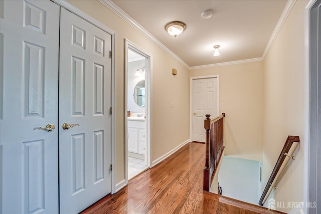 4 Hollis Rd, East Brunswick, NJ 08816 - hallway featuring an upstairs landing, crown molding, and dark wood finished floors