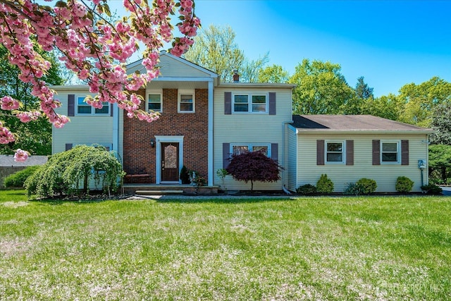 4 Hollis Rd, East Brunswick, NJ 08816 - view of front facade with a front lawn and a chimney