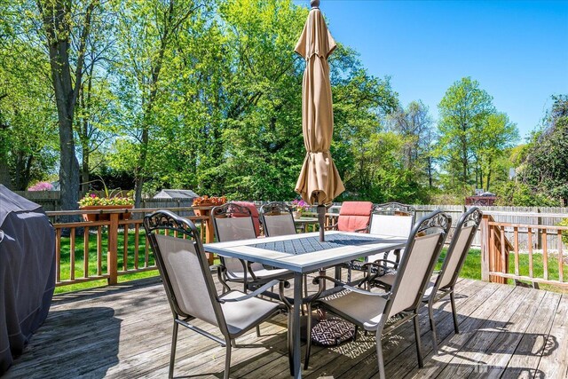 4 Hollis Rd, East Brunswick, NJ 08816 - wooden deck with outdoor dining area, a fenced backyard, and grilling area