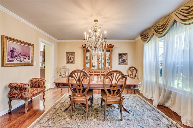 4 Hollis Rd, East Brunswick, NJ 08816 - dining room with a chandelier, wood finished floors, and ornamental molding