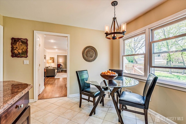 4 Hollis Rd, East Brunswick, NJ 08816 - dining space with a chandelier and light tile patterned flooring